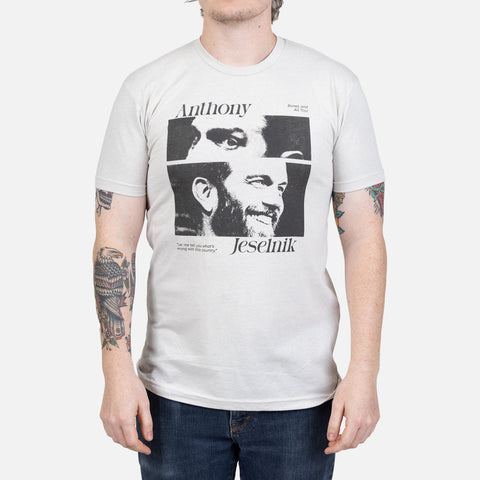 Sand colored shirt on model with graphic of Anthony Jeselnik with text "Anthony Jeselnik"